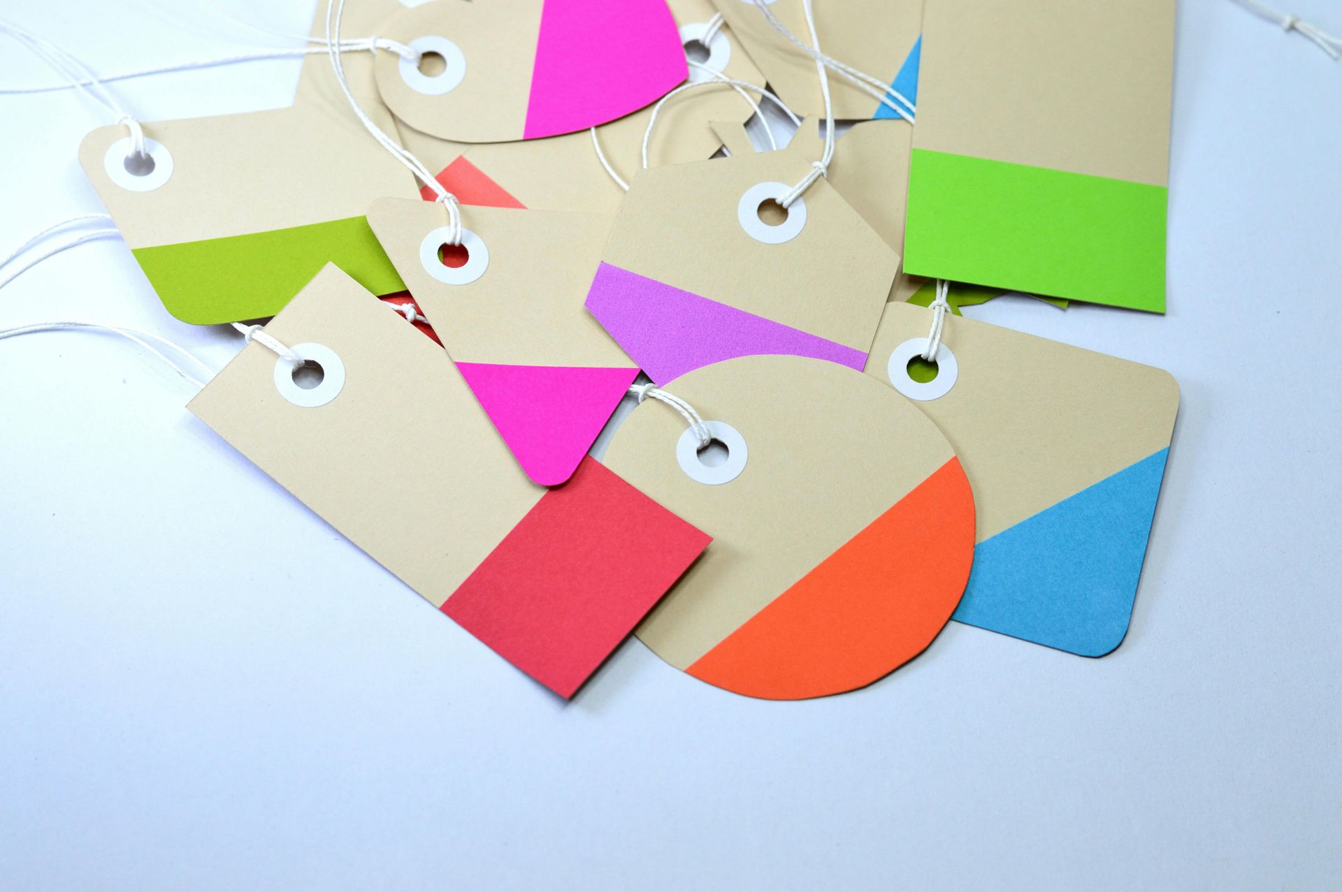 Kraft paper gift tags with colorful painted edges.