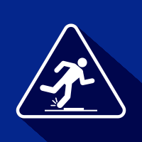 White slipping hazard warning sign on a blue background, with a person slipping near a low obstacle.