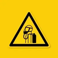 Yellow warning sign with a helmeted worker beside a fire extinguisher icon