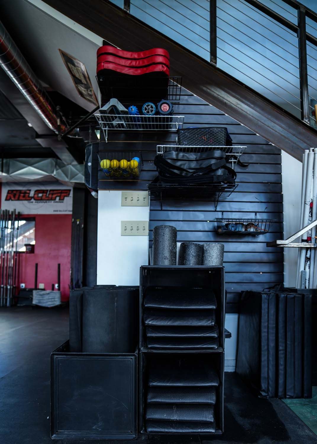 A staircase leading up to a gym with a sign that says ' agility ' on it