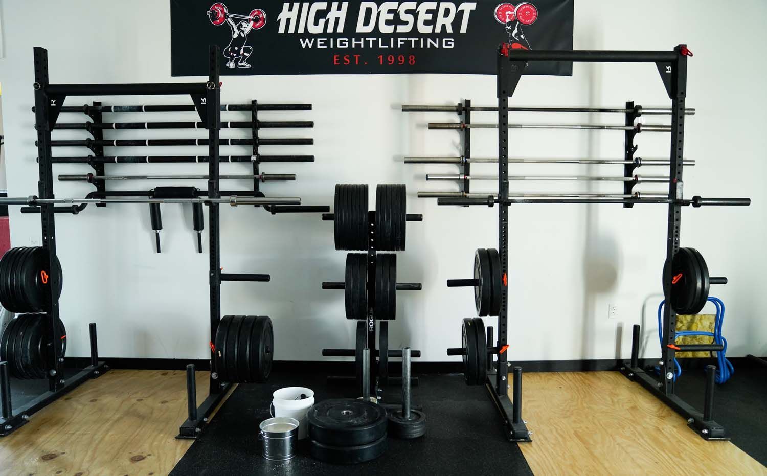 A gym with a sign that says high desert weightlifting