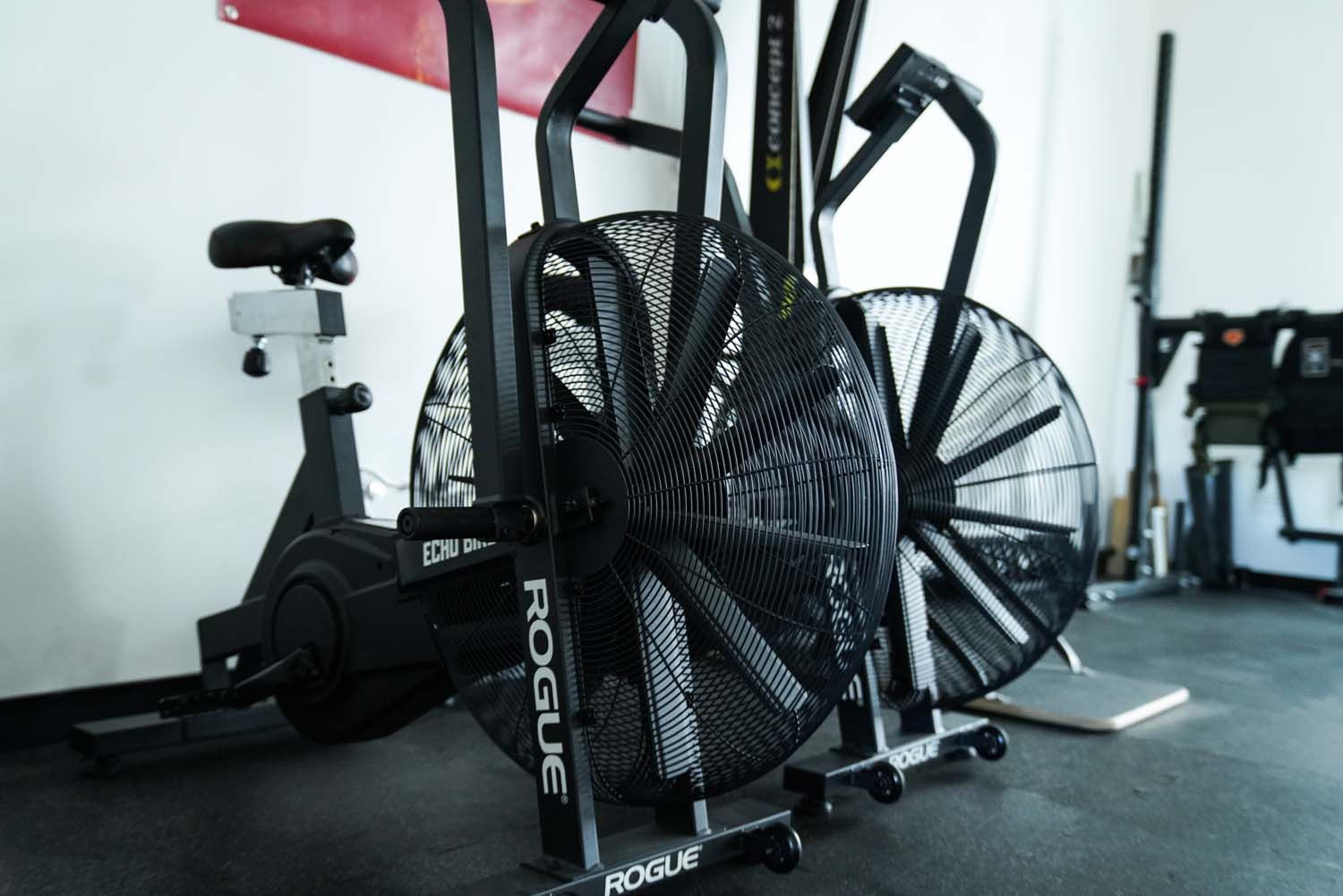 A rogue exercise bike with a fan attached to it