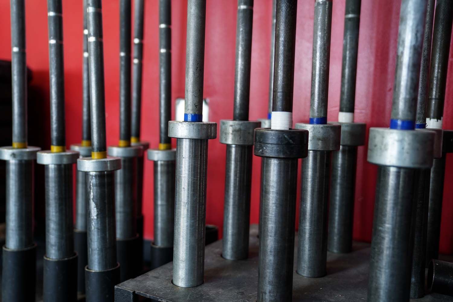 A bunch of metal bars sitting on top of a wooden table.