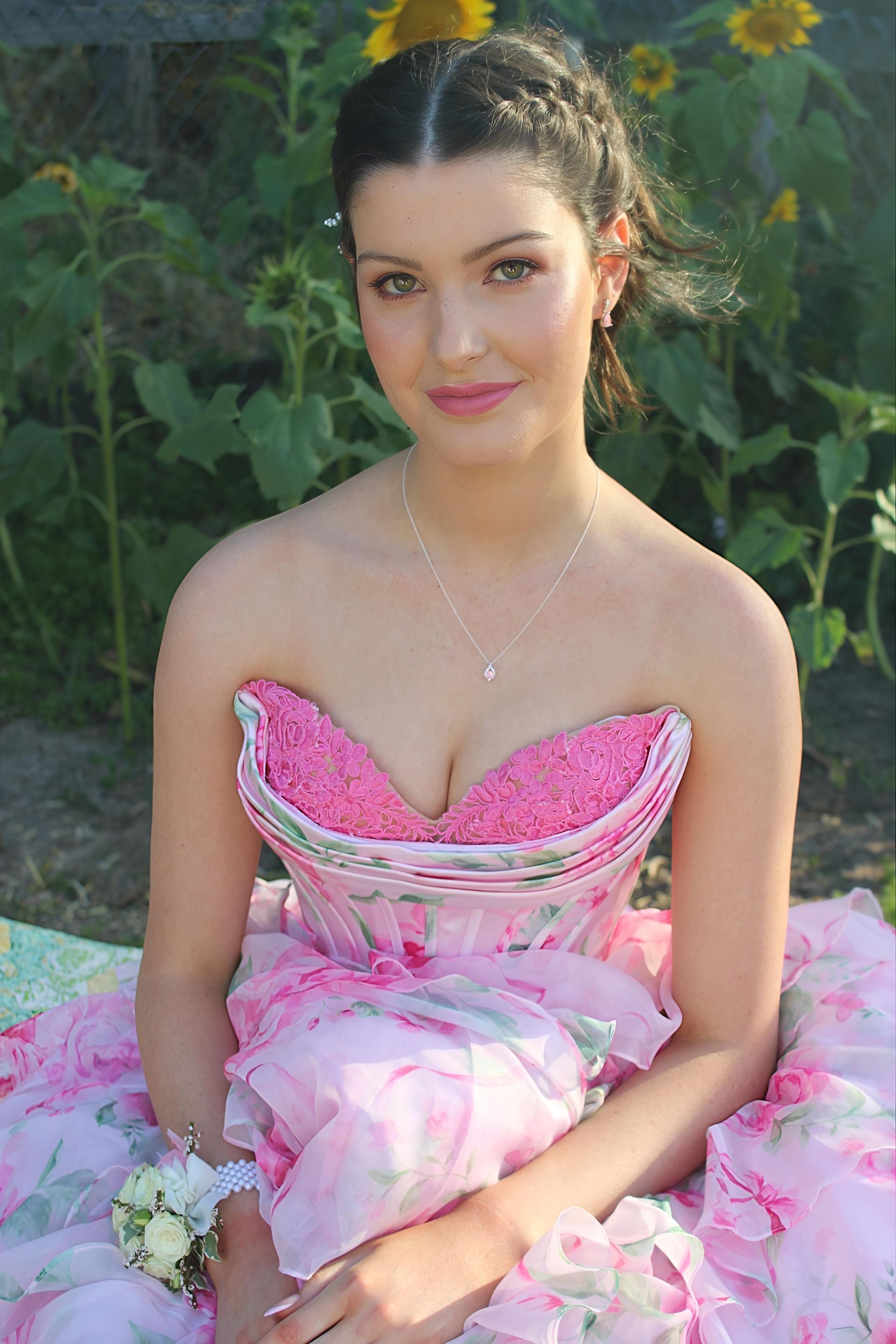 Young school girl in a pink formal dress with light makeup