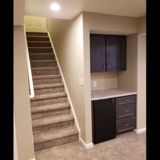 A basement with stairs leading up to the second floor.