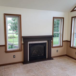 There is a fireplace in the middle of the room.