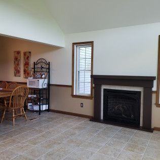There is a fireplace in the middle of the room.