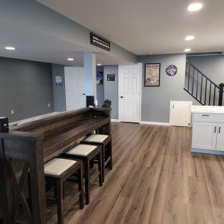A living room with a wooden table and stools