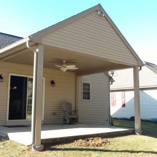A house with a porch and a ceiling fan