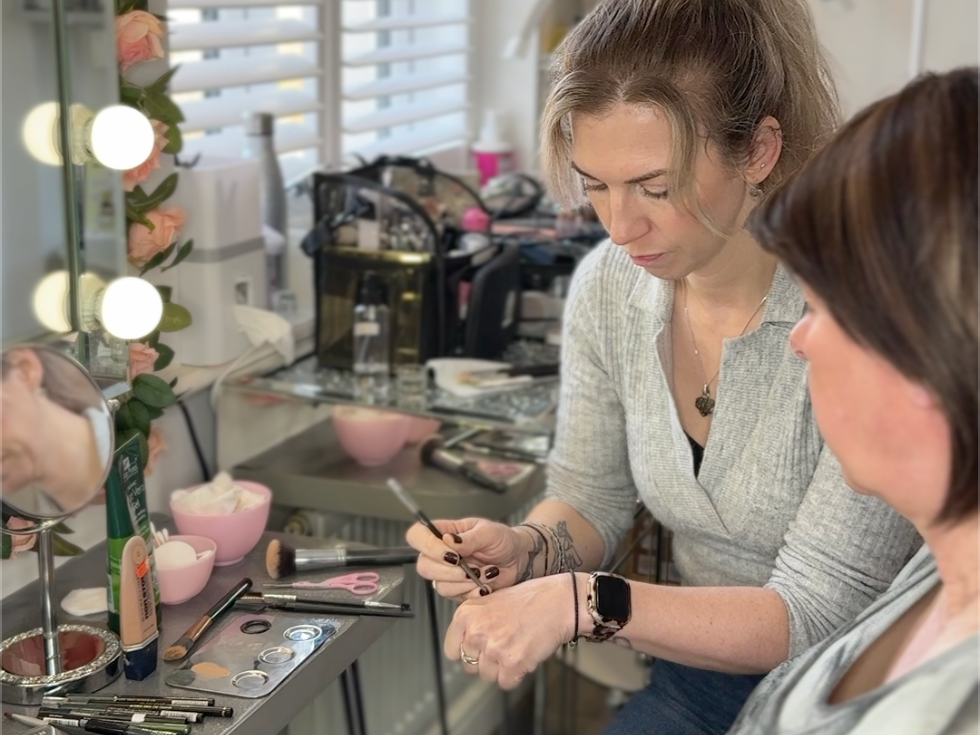 Beauty therapist providing one-to-one skincare treatment in a private salon, creating a calm and welcoming space