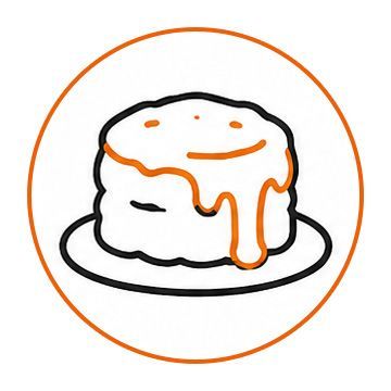 Black-and-white cake slice with orange glaze on a plate inside an orange circle icon