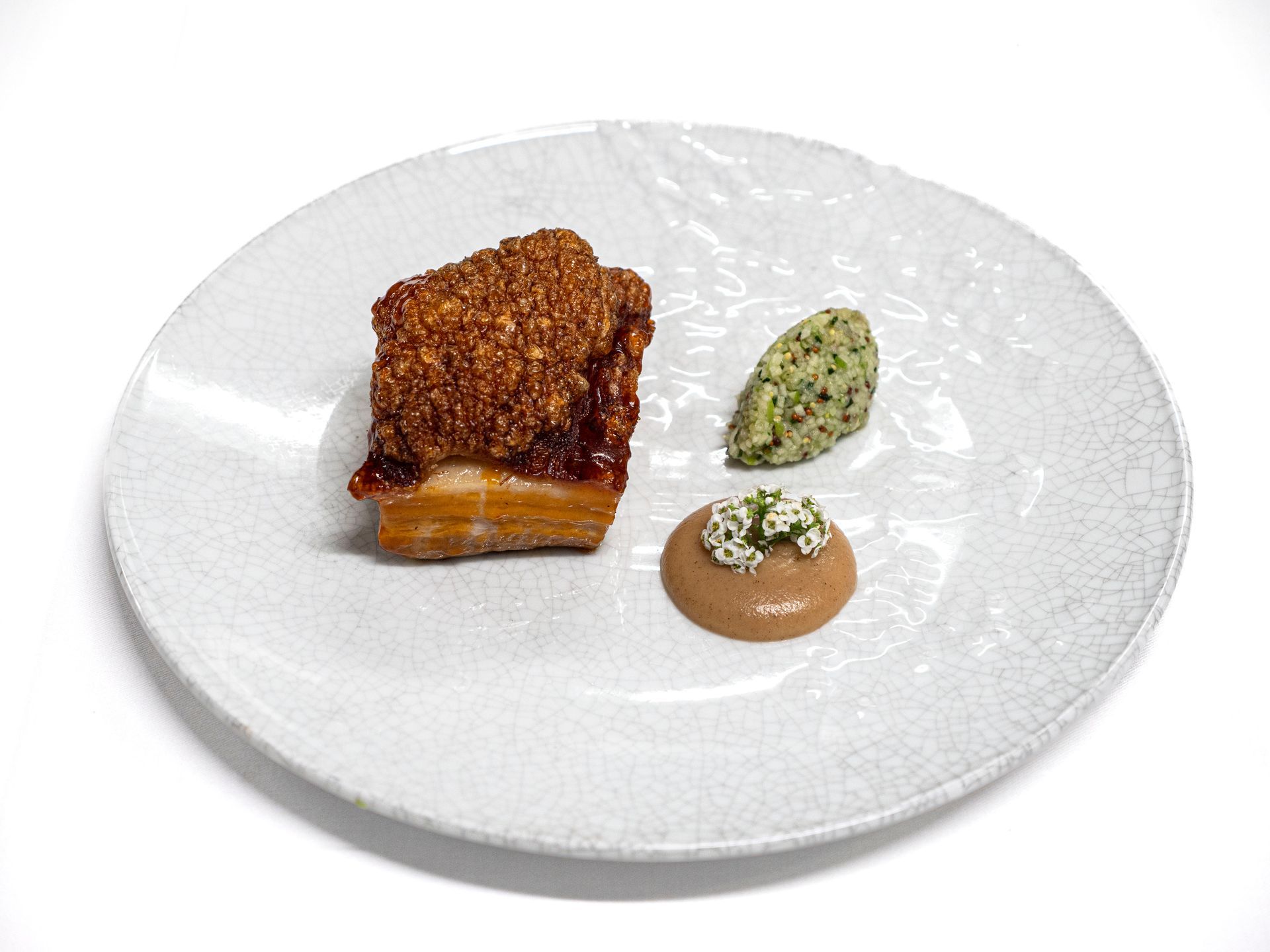 Elegant plated gourmet dish prepared for a private home dinner
