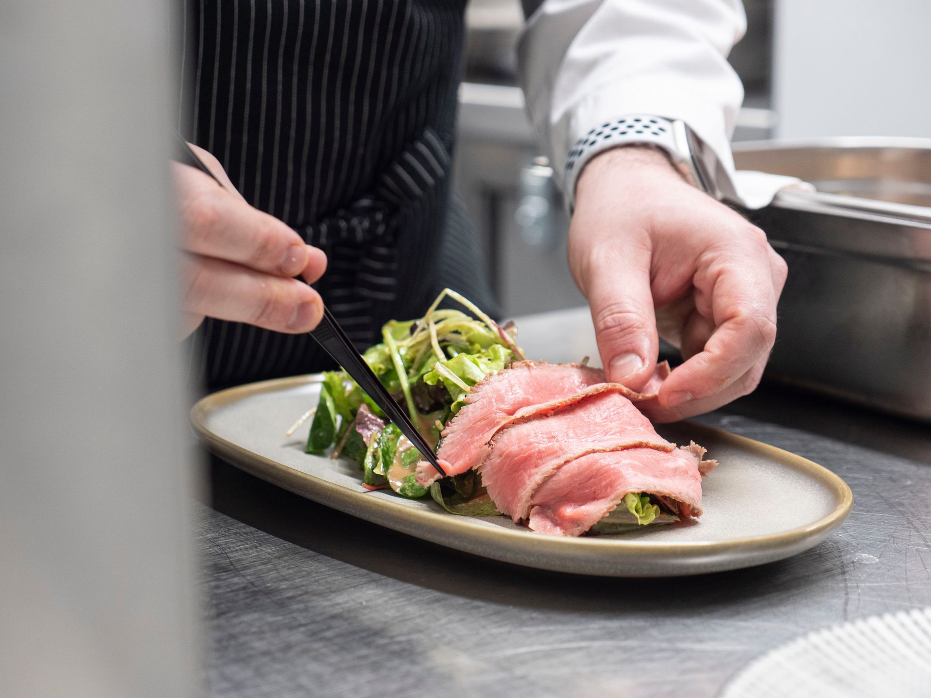 Private chef Antonio Satta creating refined dishes for a home dining experience

