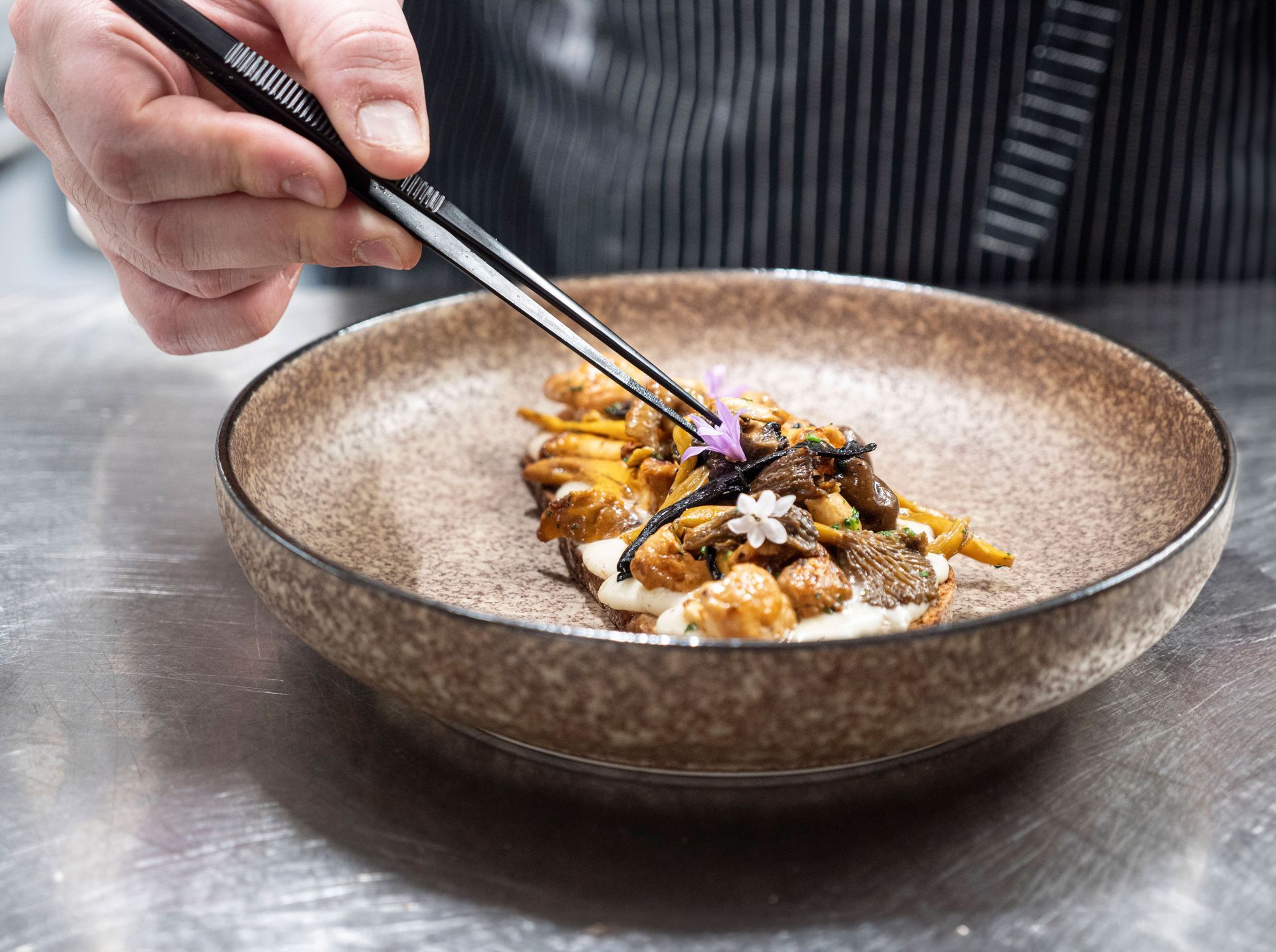 Private chef Antonio Satta creating refined dishes for a home dining experience
