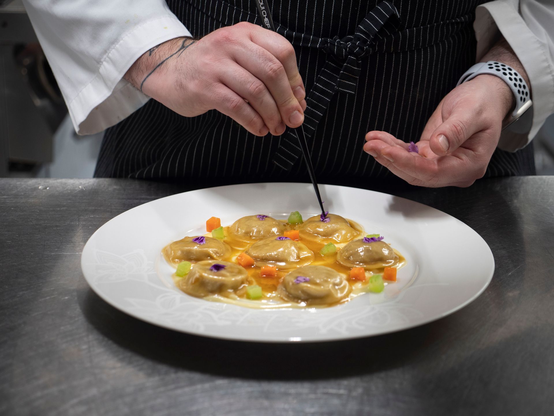 Chef Antonio Satta cooking during an exclusive private culinary experience
