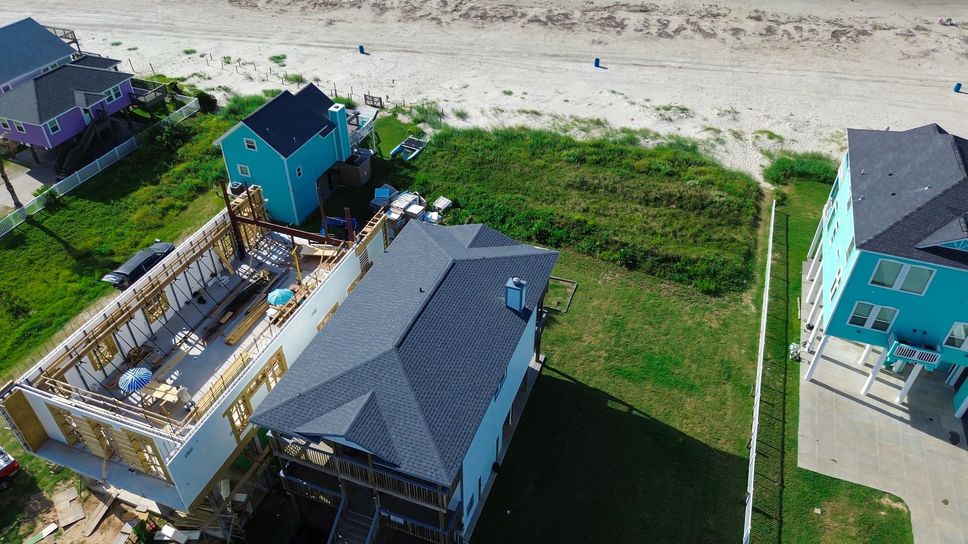 Elevated beach home under construction reflecting building renovation services standards