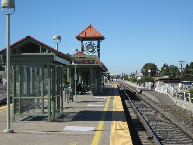 A train station with a clock on top of it