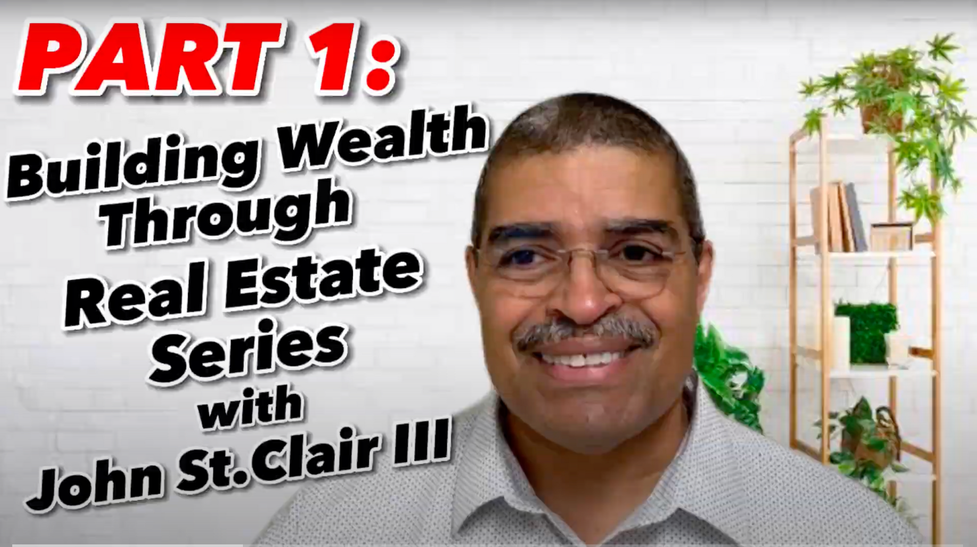 A man with glasses and a mustache is smiling and talking about building wealth through real estate.