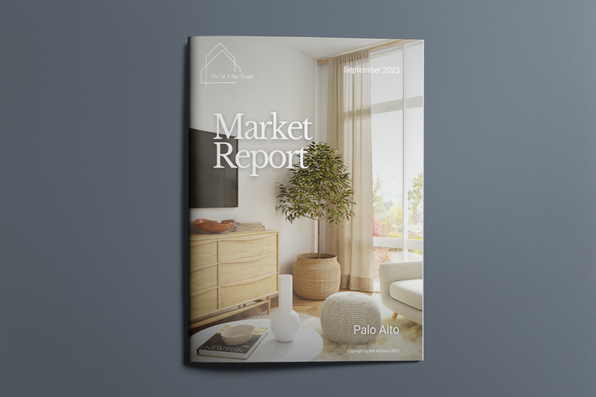 A market report with a living room on the cover is sitting on a table.