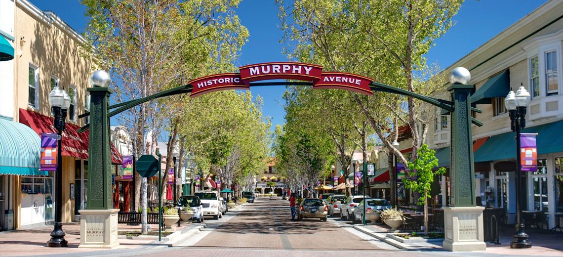 A city street with a sign that says hungry on it.
