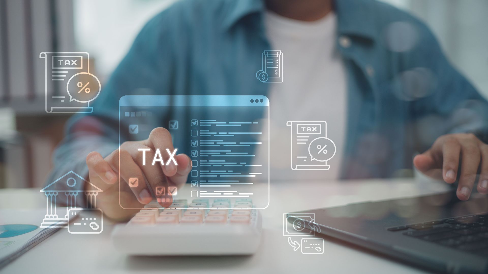 Person using calculator and laptop with virtual tax and finance icons overlay. Person using calculator and laptop with virtual tax and finance icons overlay.