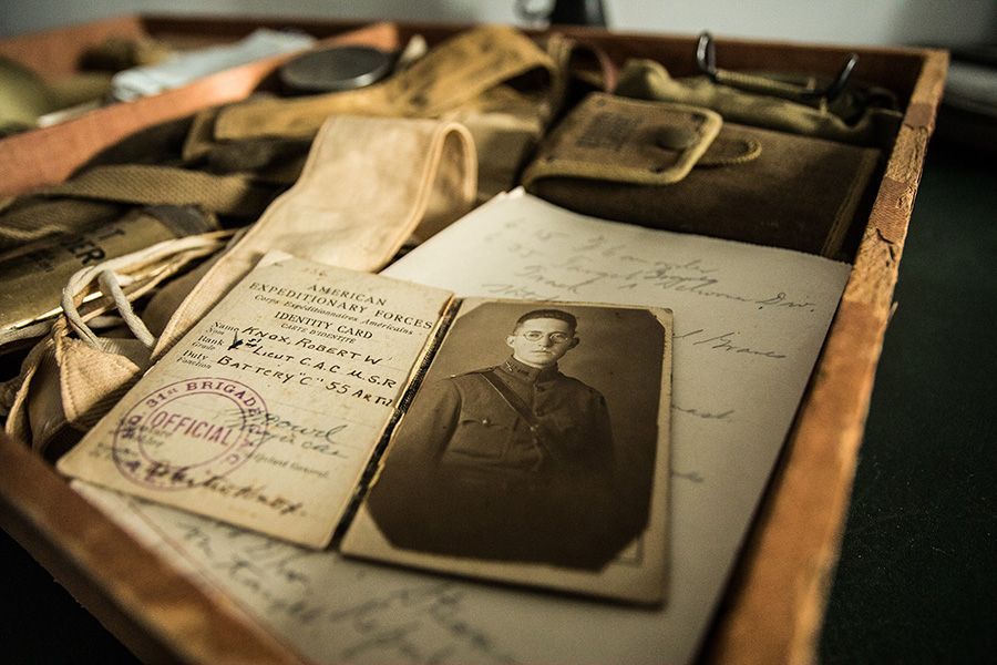 A person is taking a picture of a man and a boy in a photo album.