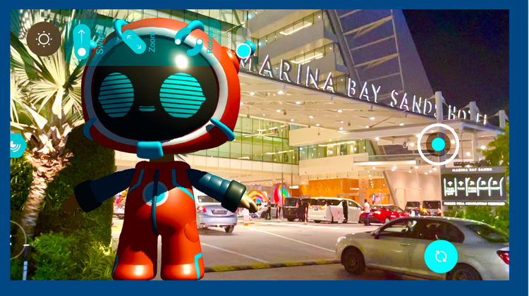A robot is standing in front of a marina bay sands hotel