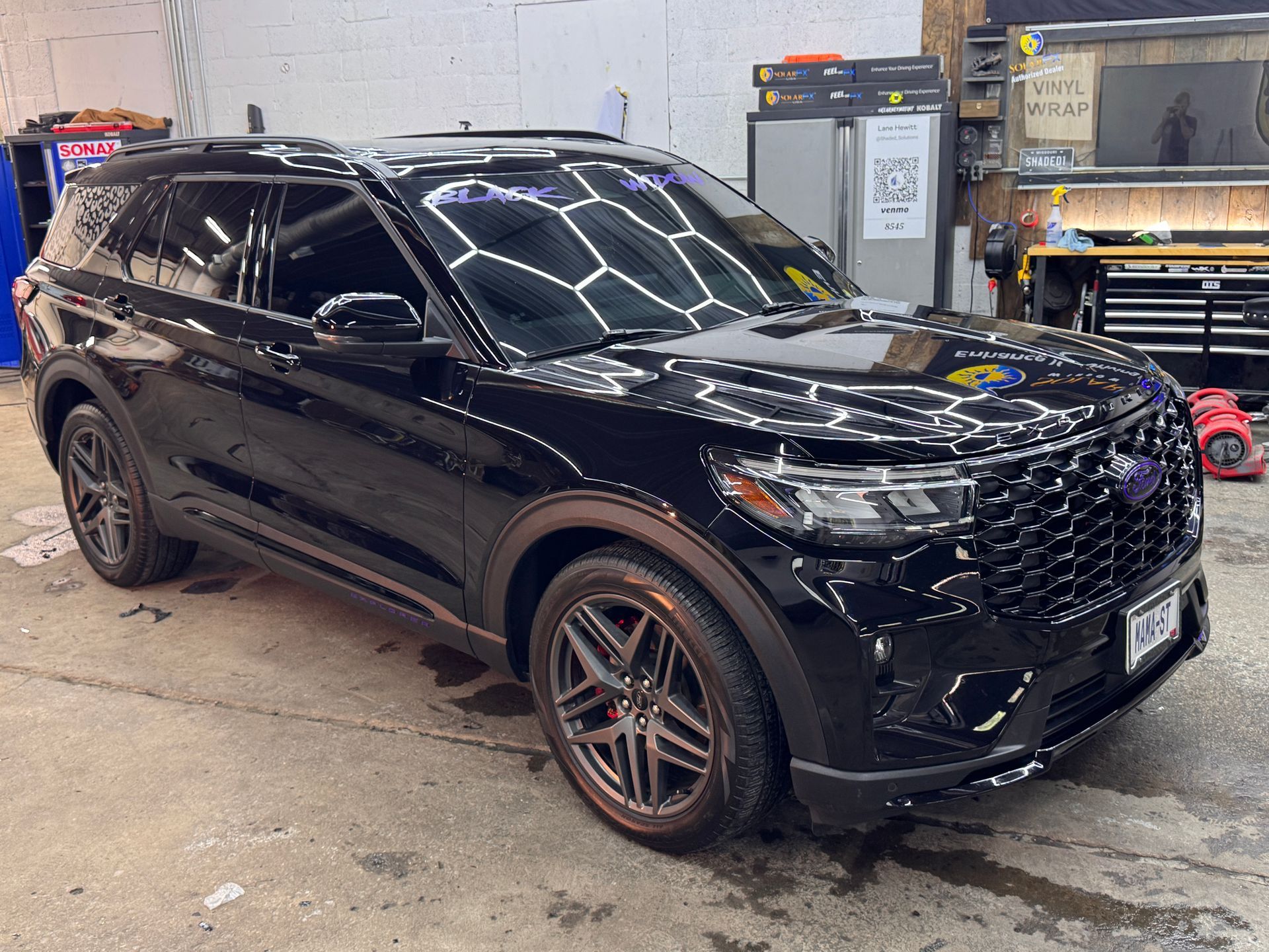 Black Explorer ST with ceramic window tint on all windows and windshield at Kearney Auto Restyling