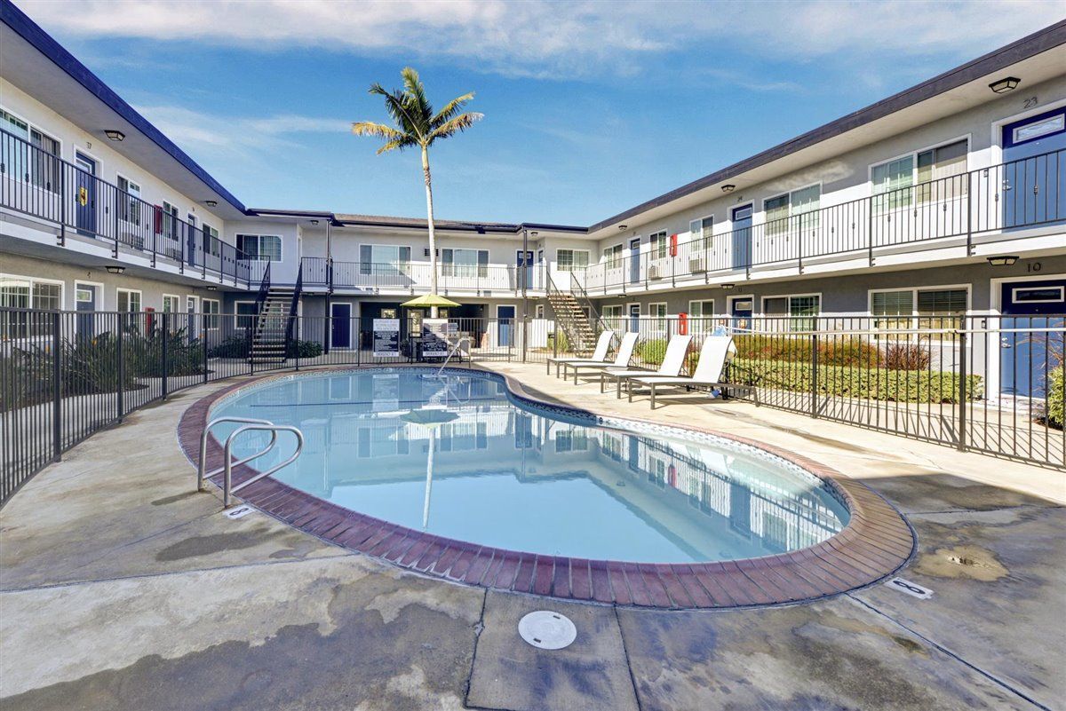 community pool and lounge chairs