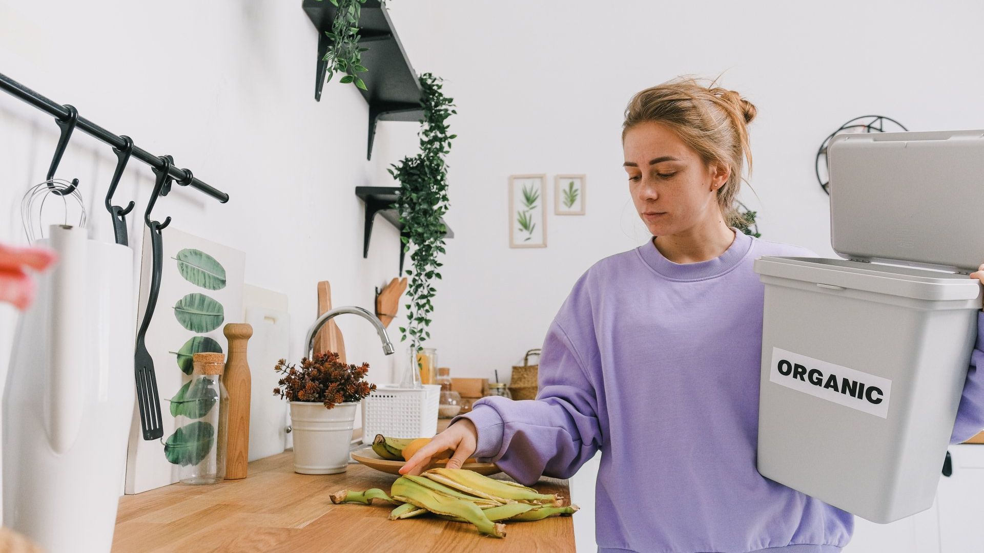 Woman holding a container for Organic Waste Recycling