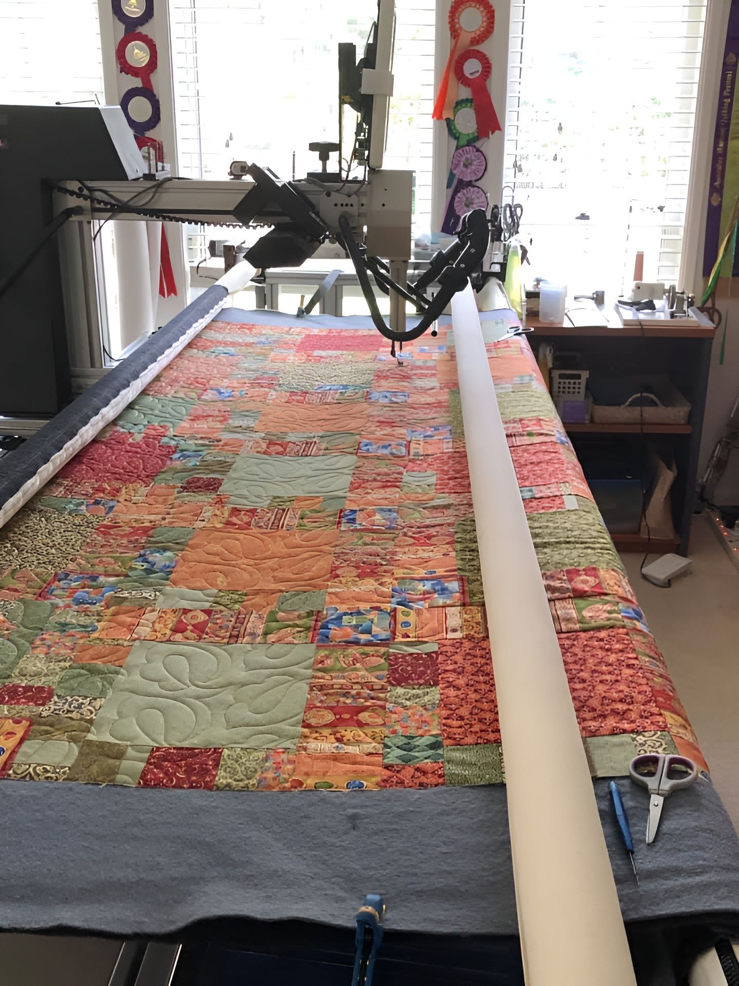 Quilting Machine With Colourful Patchwork Quilt — Morning Star Quilting in Bateau Bay, NSW