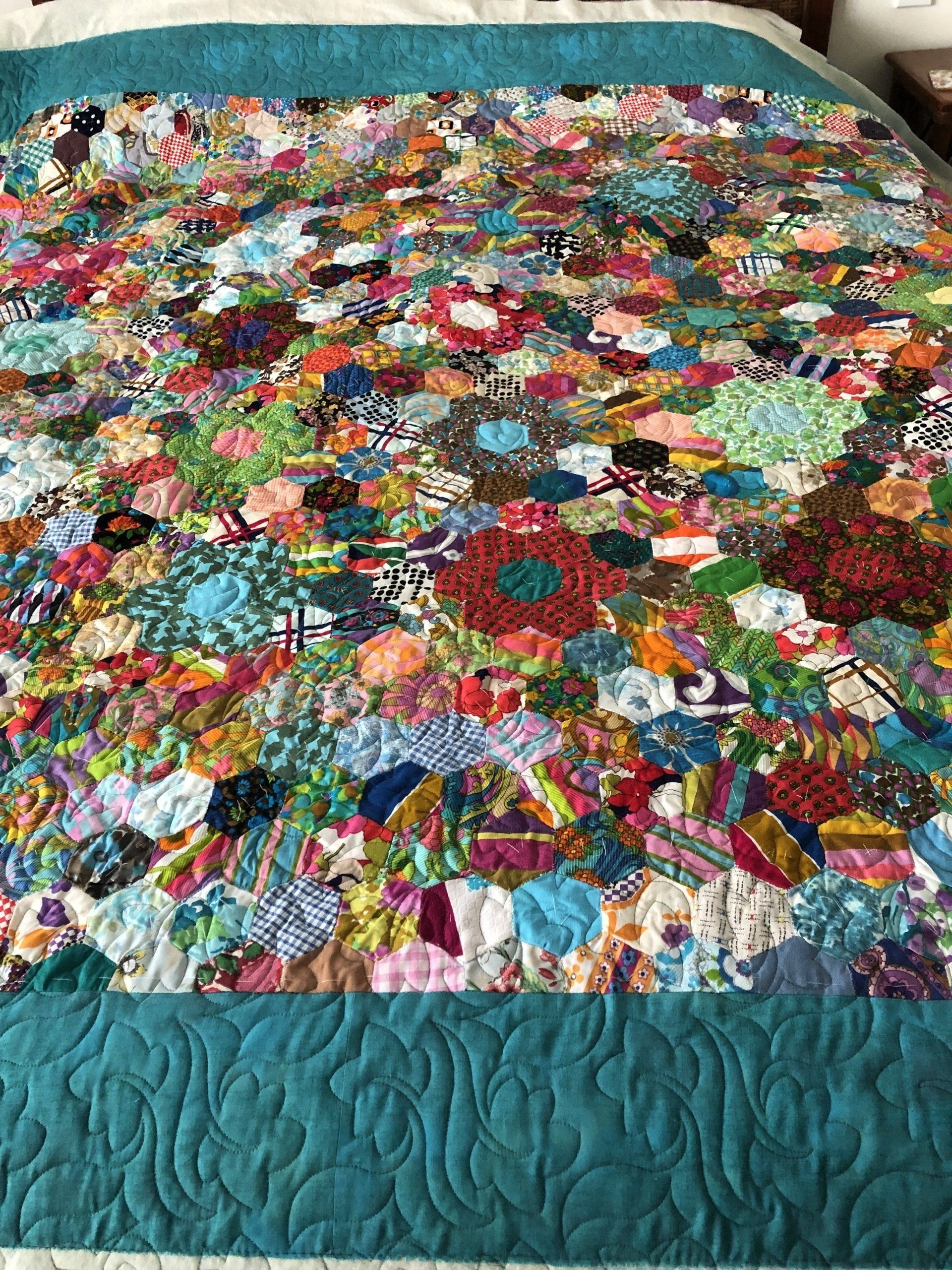 Colourful, Textured Quilt With a Teal Border and Patterned Interior — Morning Star Quilting in Bateau Bay, NSW