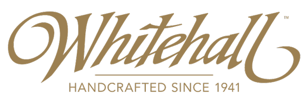 Whitehall logo in gold, cursive font, with