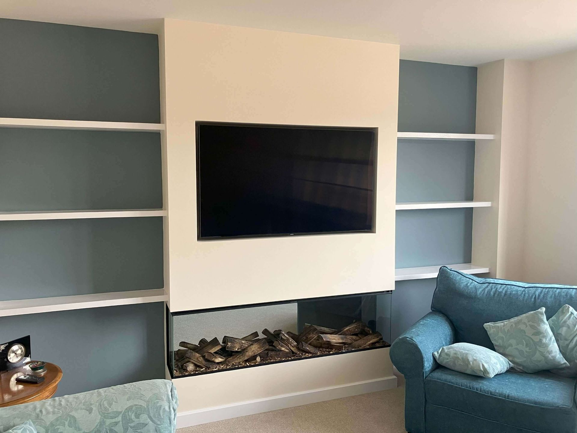 new forest electric fire with real wooden logs in a media wall