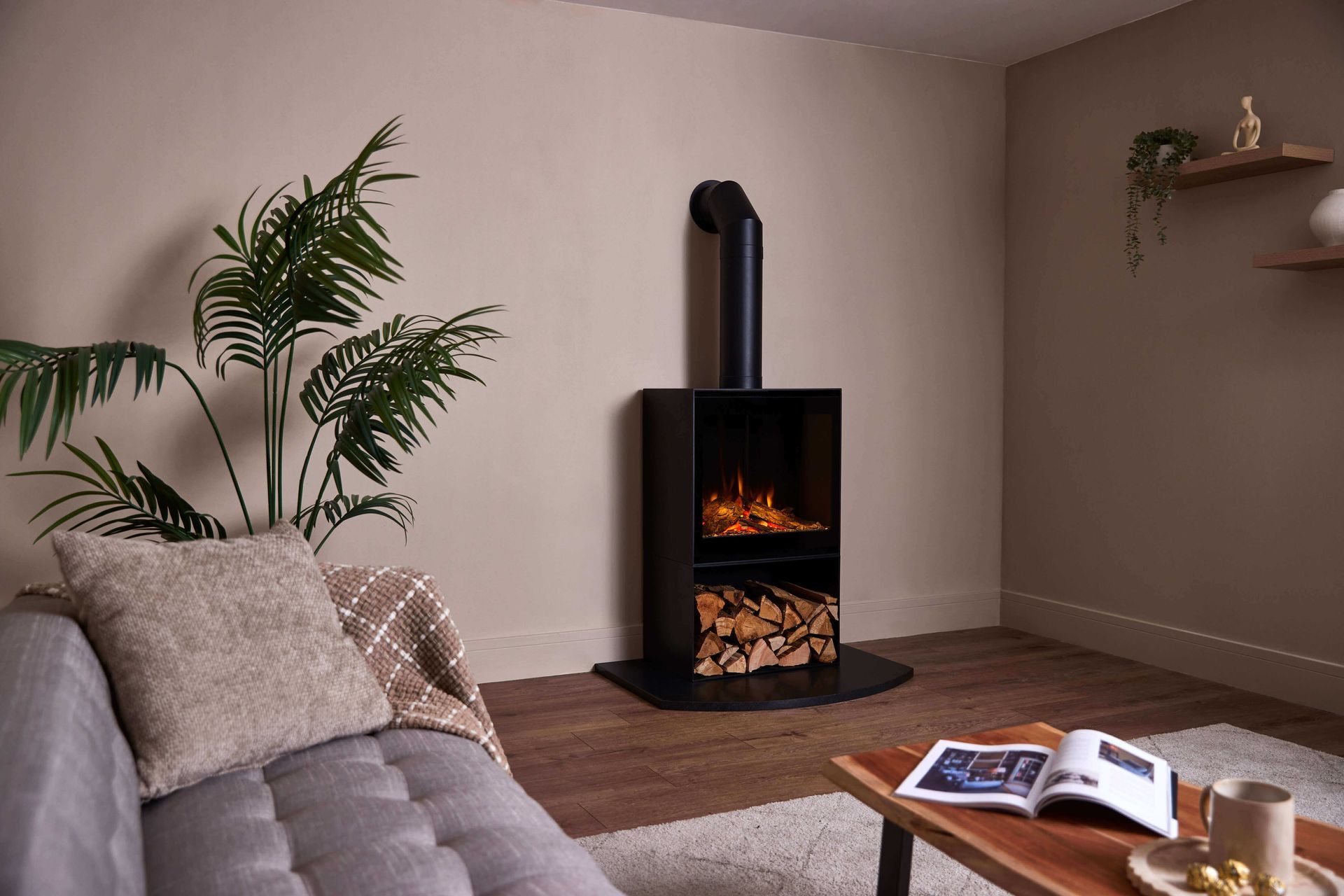 british fires cube stove with glass door and flue pip