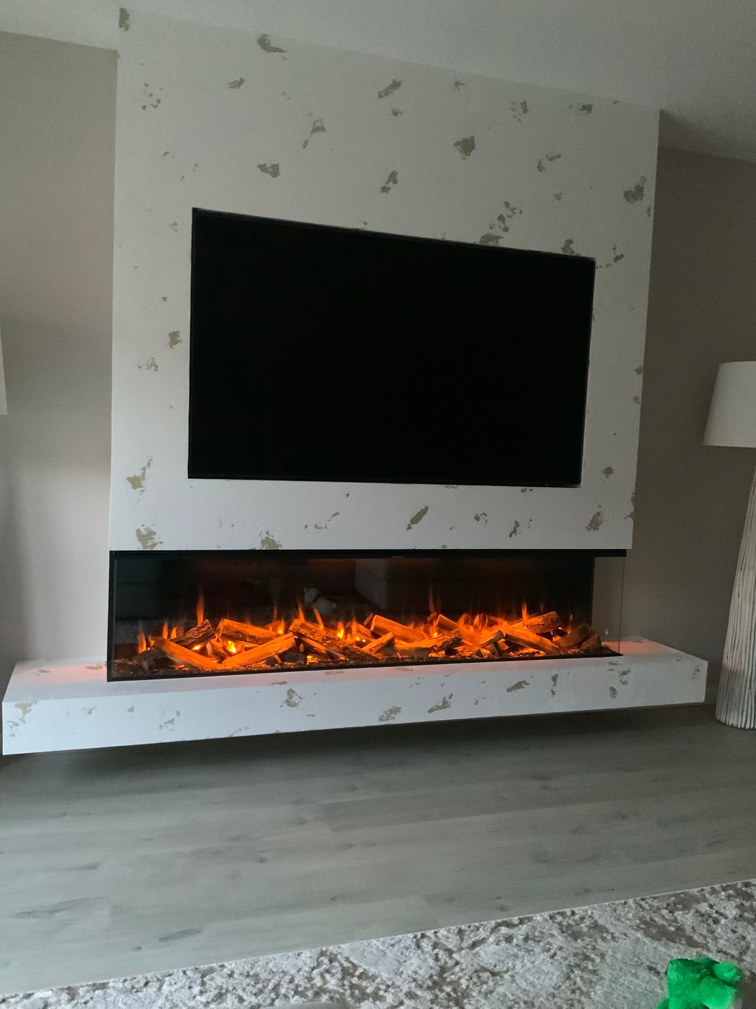 venetian plastered media wall with new forest 1900 electric fire