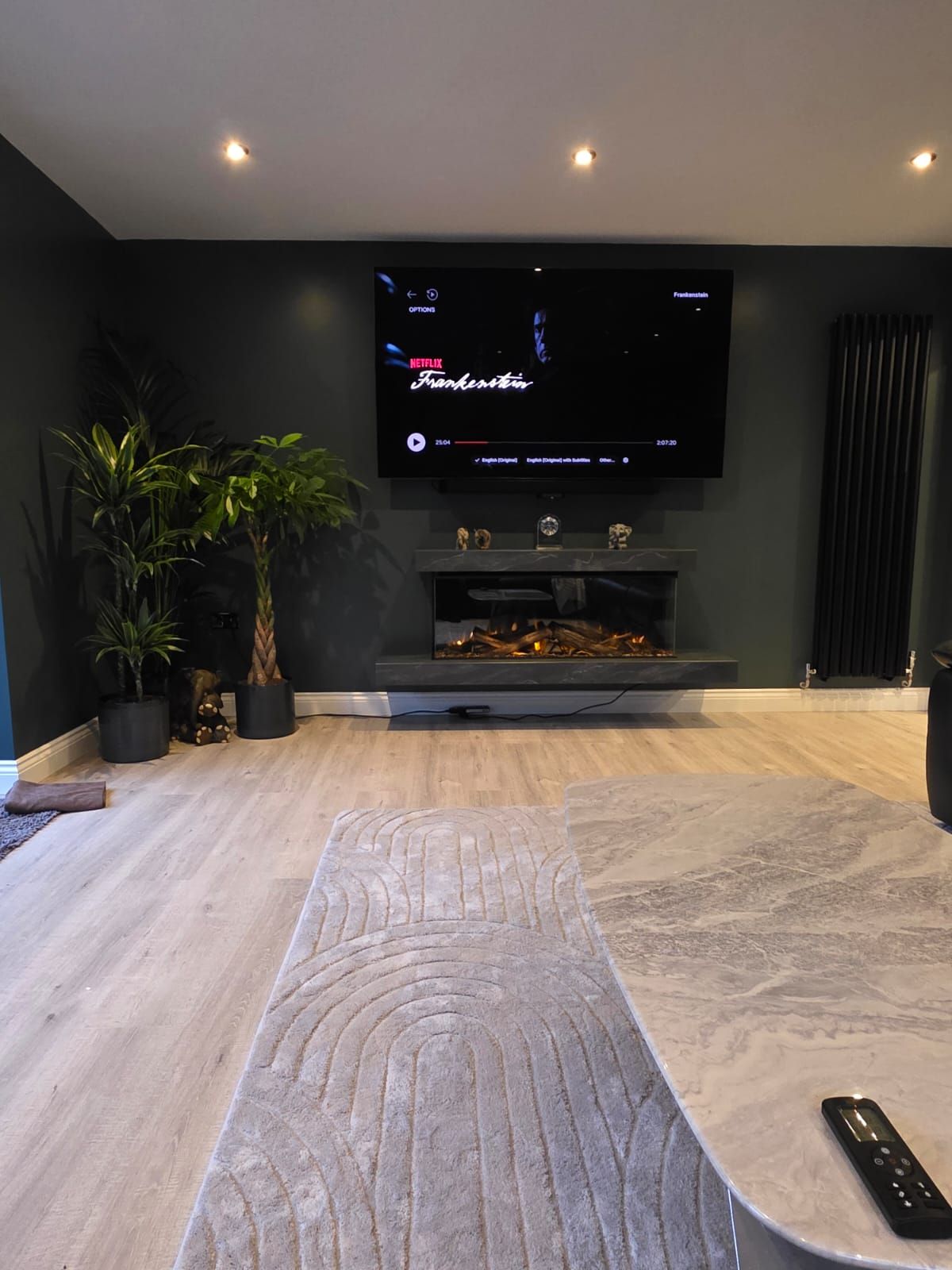 brockenhurst suite on a dark green wall electric fire