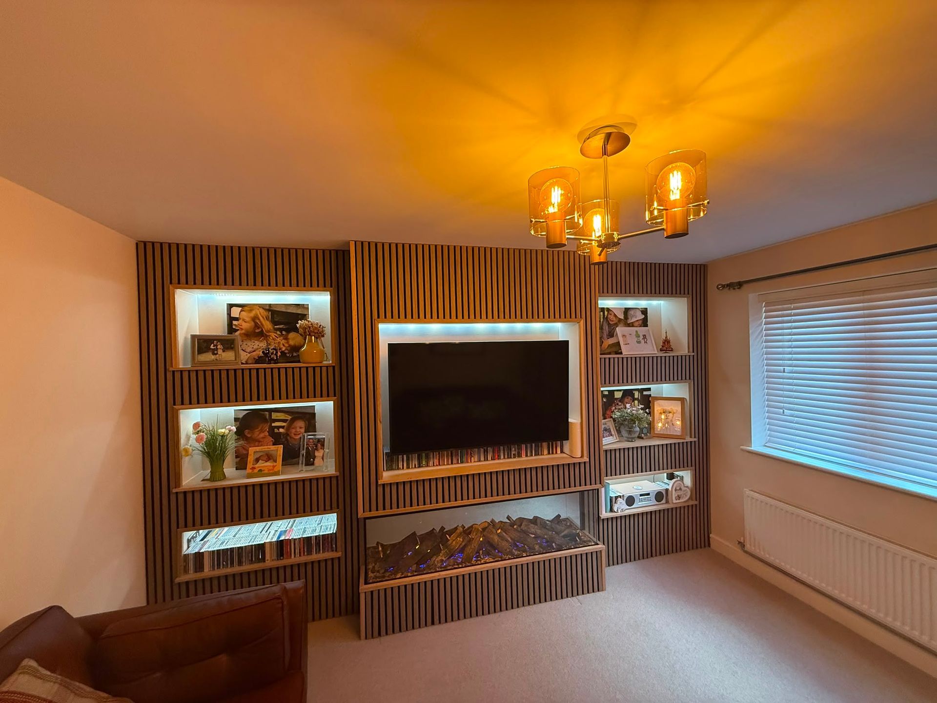 new froest 1600 in a media wall with acoustic slat wall