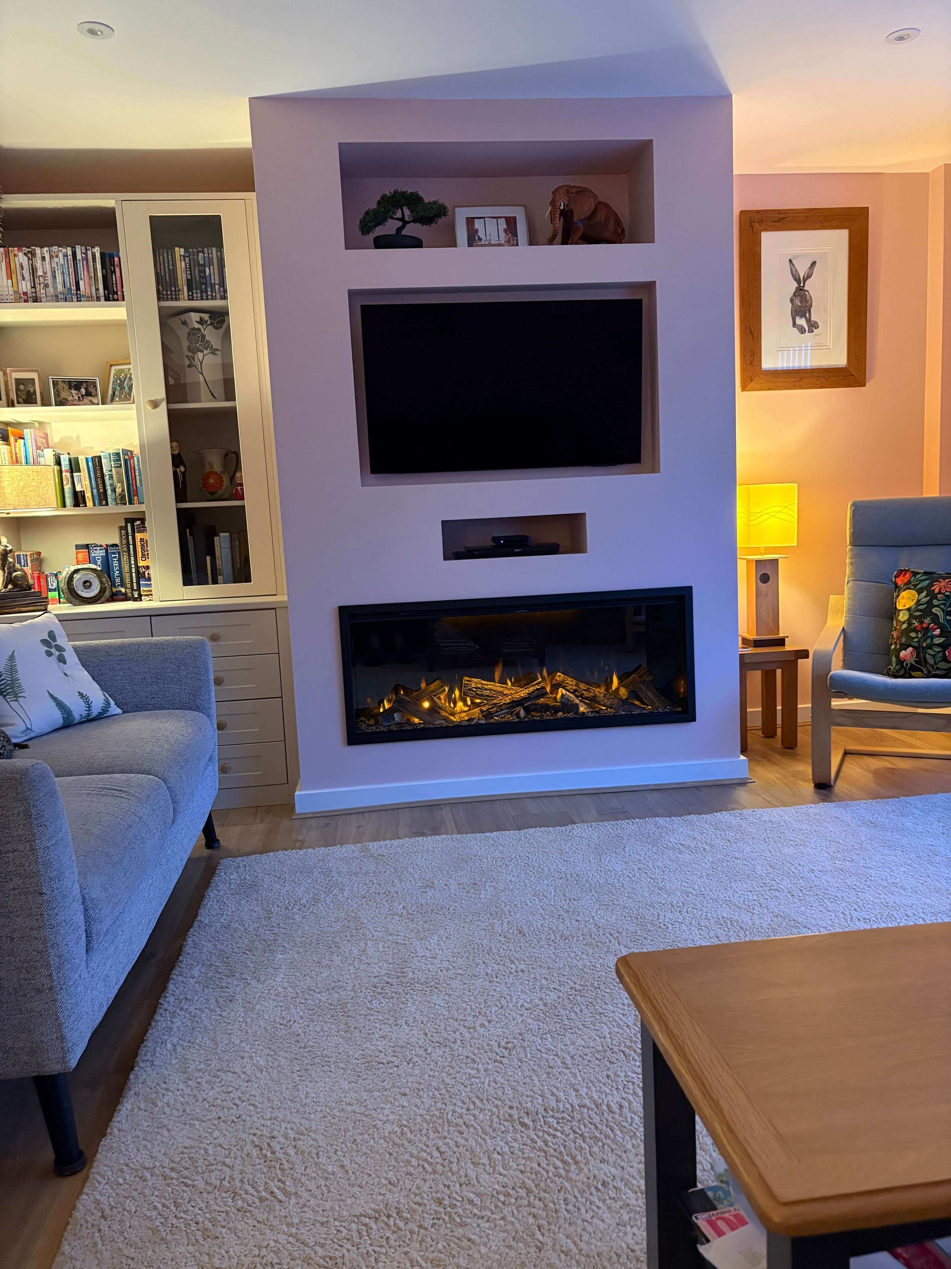 british fires 1200 with all upgrades in a media wall with front facing trim