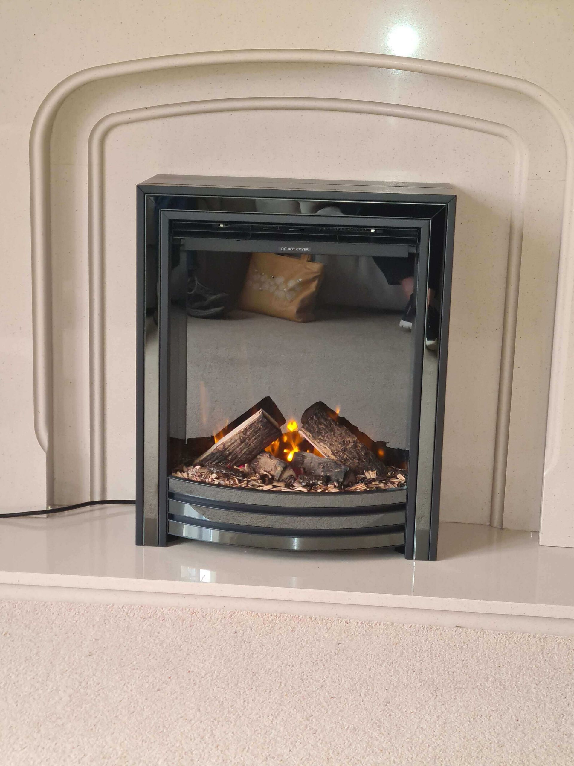 small electric fire on exisitng fireplace
