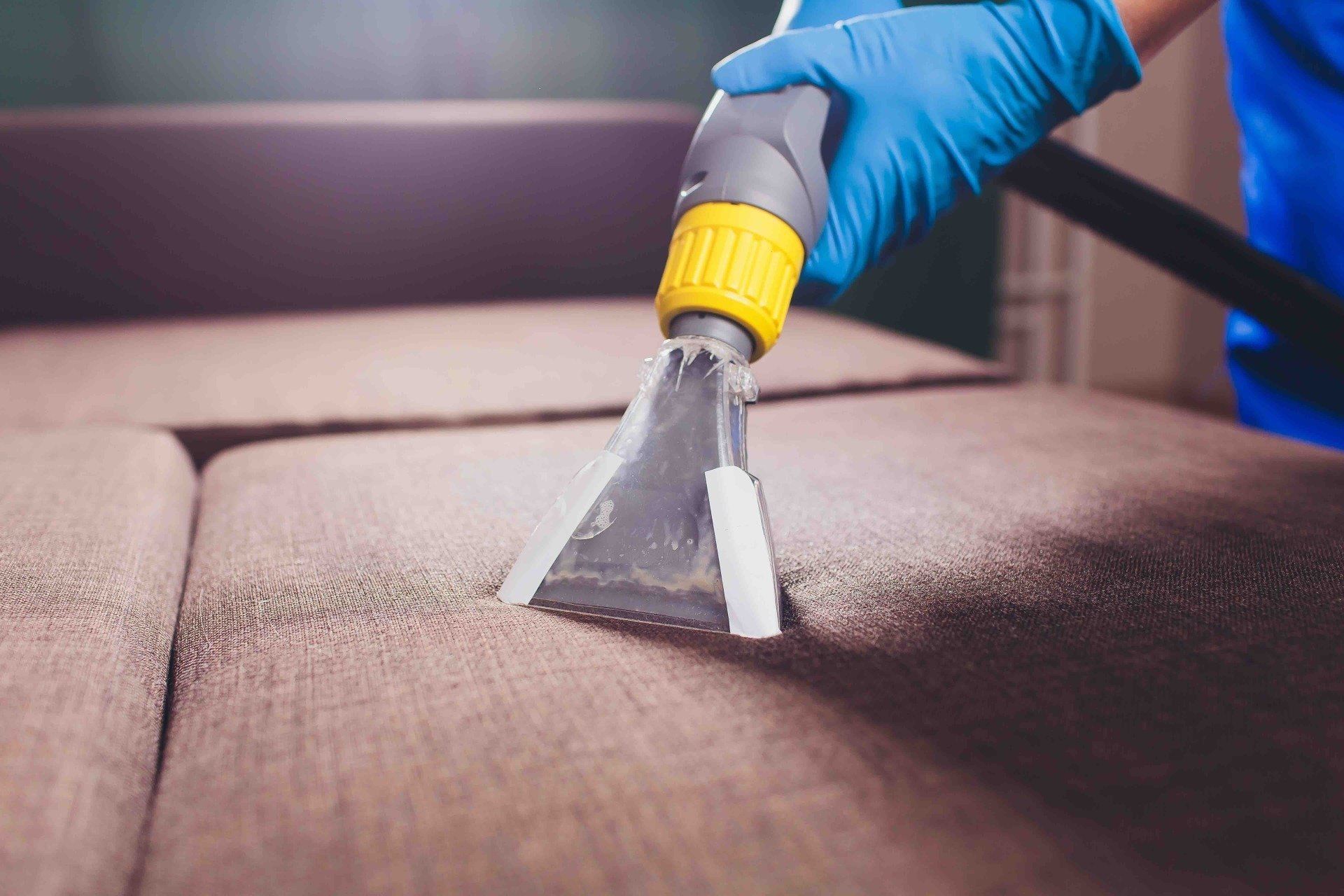 A Man Cleaning Sofa