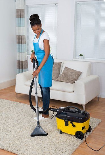 Women Doing A Vacuum Cleaning Women Doing A Vacuum Cleaning