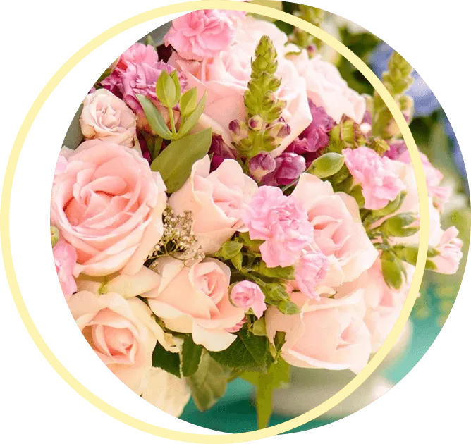 A bouquet of pink and purple flowers A bouquet of pink and purple flowers in a gold circle