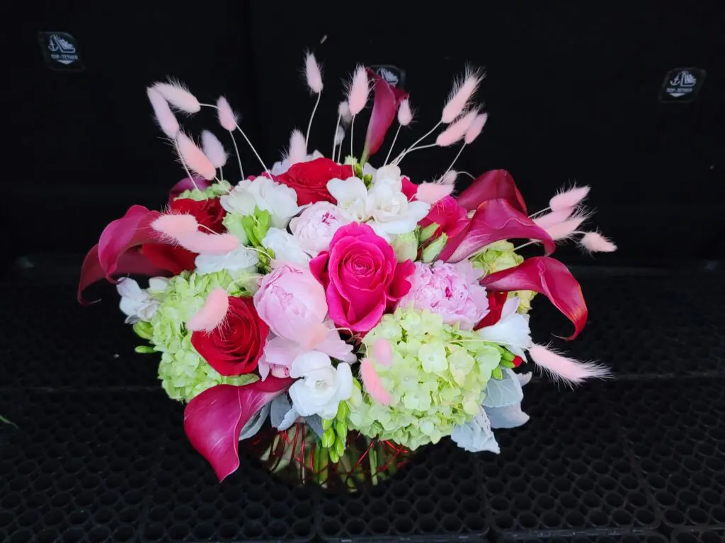 A bouquet of pink and white flowers in a vase