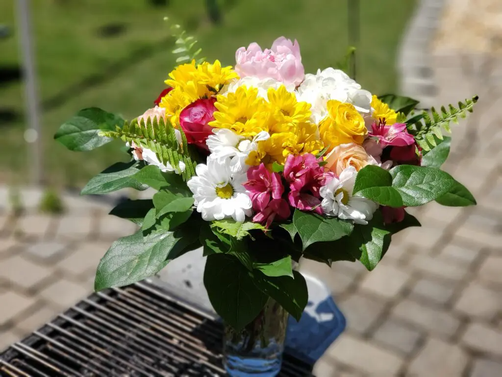 A vase filled with flowers is sitting on a table.