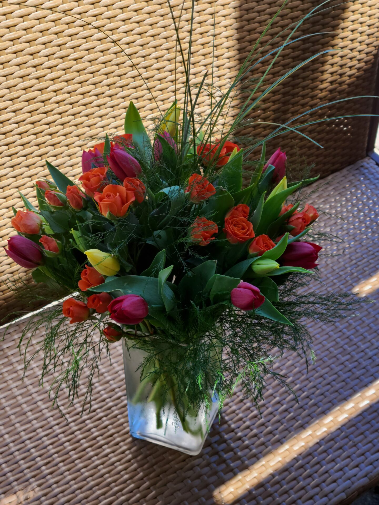 A vase filled with flowers is sitting on a table.