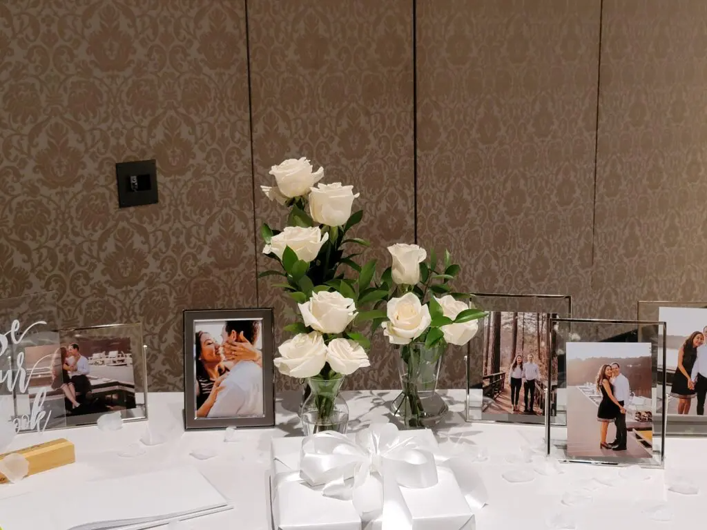 A table with flowers and pictures on it