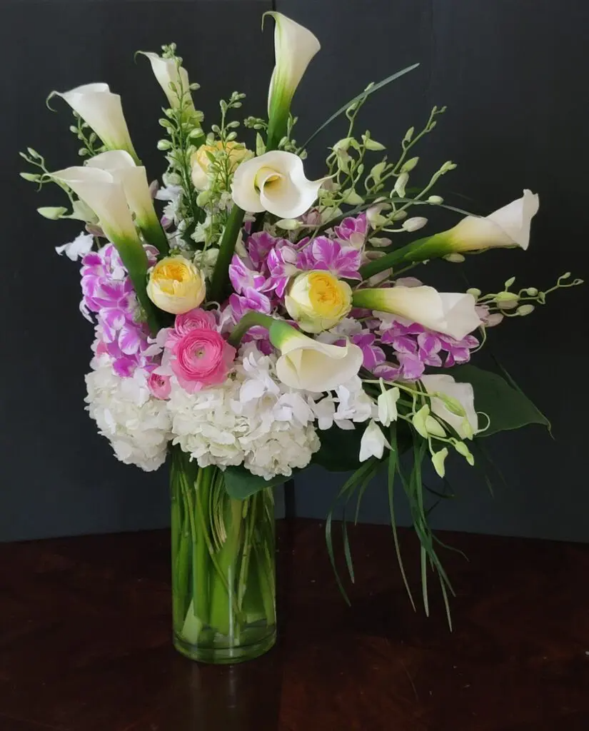 A vase filled with flowers is sitting on a table