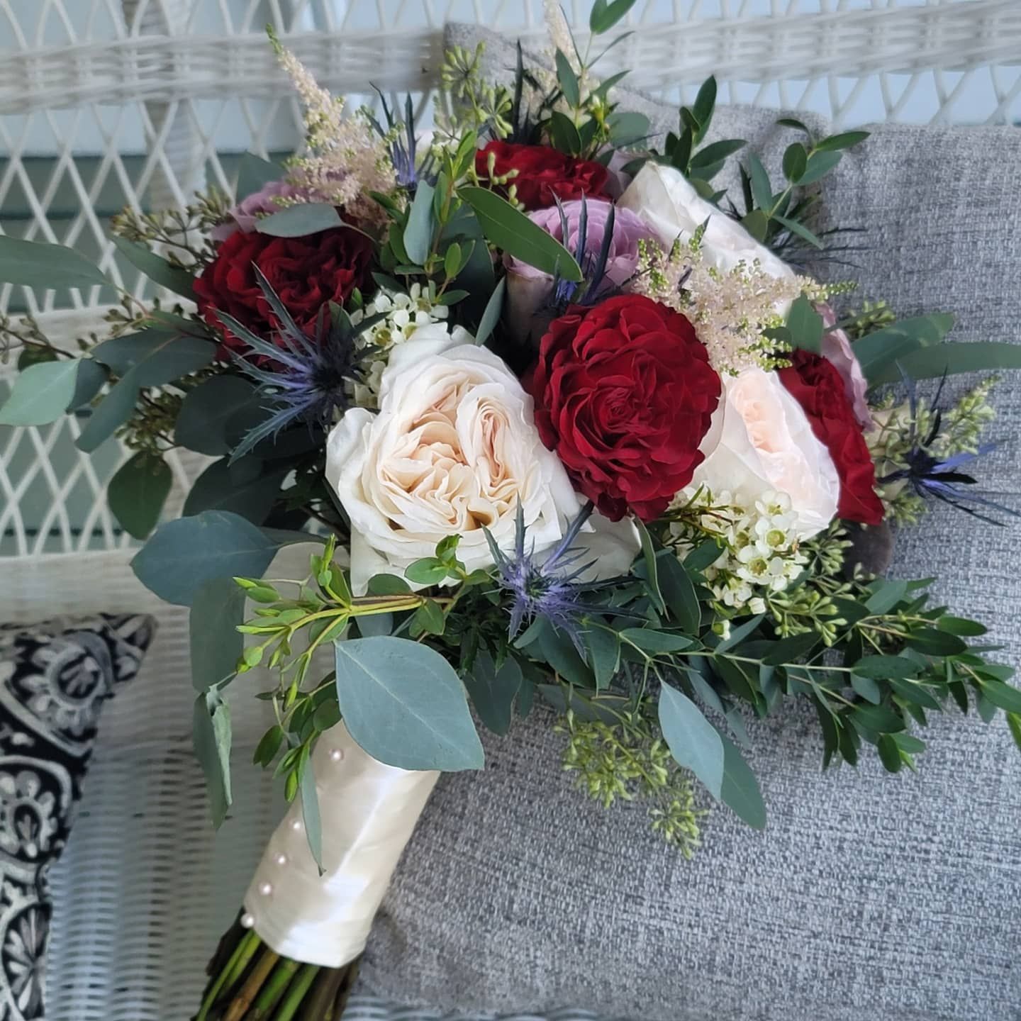 A bouquet of flowers is sitting on a chair