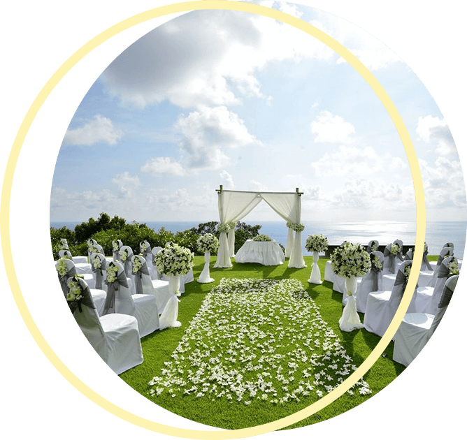A wedding ceremony is set up on a hill overlooking the ocean A wedding ceremony is set up on a hill overlooking the ocean